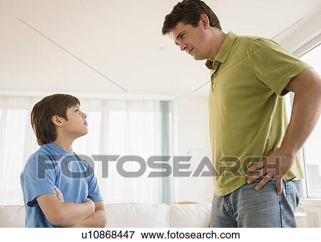 Father and son (8-9) arguing View Large Photo Image Stock Photo - Father and son (8-9) arguing. Fotosearch