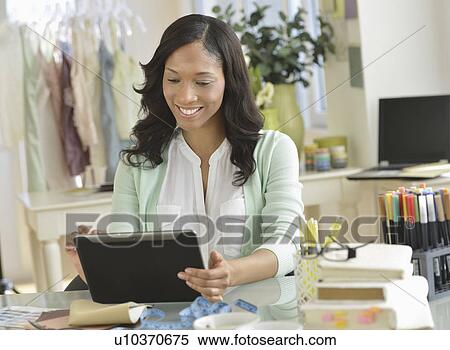 Female entrepreneur using digital tablet View Large Photo Image Stock Photography - Female entrepreneur using digital tablet. Fotosearch