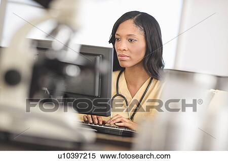 Female nurse at station View Large Photo Image Stock Photography - Female nurse at station. Fotosearch