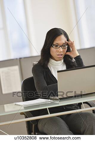 Stock Photo - Female office worker. Fotosearch