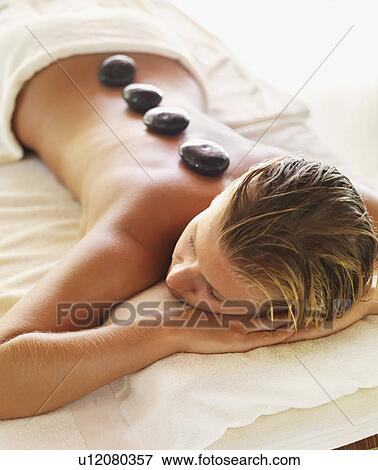 getting hot stone therapy in spa View Large Photo Image Stock Photo - getting hot stone therapy in spa. Fotosearch