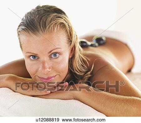 getting hot stone therapy in spa View Large Photo Image Stock Photo - getting hot stone therapy in spa. Fotosearch