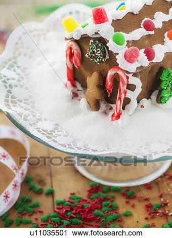 Gingerbread house on cake stand View Large Photo Image Stock Image - Gingerbread house on cake stand. Fotosearch