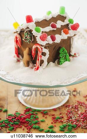 Gingerbread house on cake stand View Large Photo Image Stock Photograph - Gingerbread house on cake stand. Fotosearch