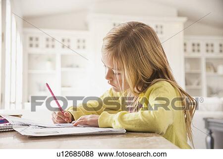 Girl (6-7) doing homework View Large Photo Image Stock Photo - Girl (6-7) doing homework. Fotosearch