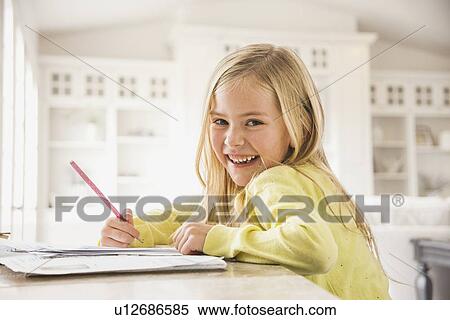 Girl (6-7) doing homework View Large Photo Image Stock Photography - Girl (6-7) doing homework. Fotosearch