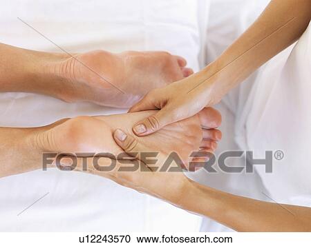 Hand massaging feet View Large Photo Image Stock Image - Hand massaging feet. Fotosearch