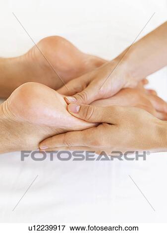 Hand massaging feet View Large Photo Image Stock Photo - Hand massaging feet. Fotosearch