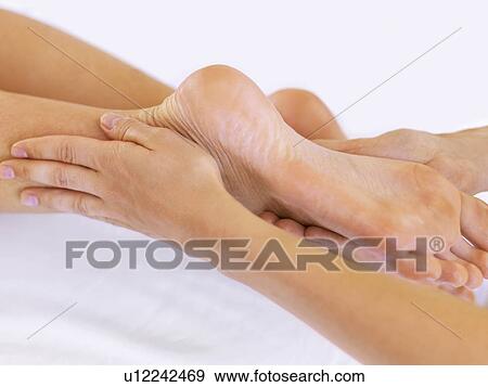 Hand massaging feet View Large Photo Image Stock Photo - Hand massaging feet. Fotosearch