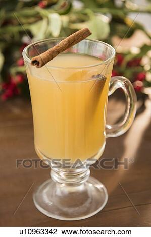 Stock Image - Hot apple cider on table. Fotosearch