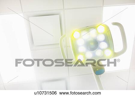 Stock Photograph - Lamp and ceiling in dentist office. Fotosearch