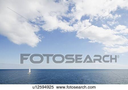 Lonely sailboat on ocean View Large Photo Image Stock Photography - Lonely sailboat on ocean. Fotosearch