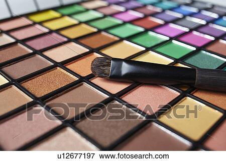 Make-up brush on eye shadow palette, studio shot View Large Photo Image Stock Photo - Make-up brush on eye shadow palette, studio shot. Fotosearch