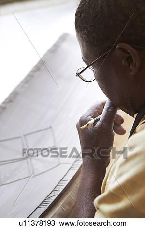 Man concentrating on design View Large Photo Image Stock Image - Man concentrating on design. Fotosearch