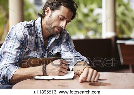 Stock Image - Man doing notes. Fotosearch