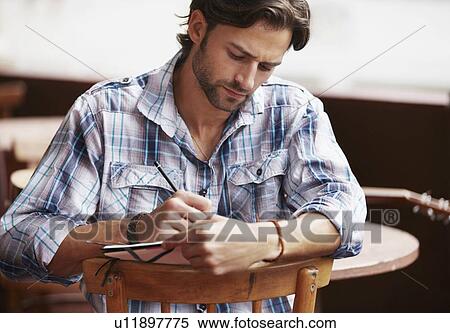 Stock Photography - Man doing notes. Fotosearch