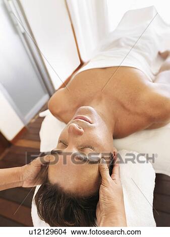 Man getting facial massage in spa View Large Photo Image Picture - Man getting facial massage in spa. Fotosearch