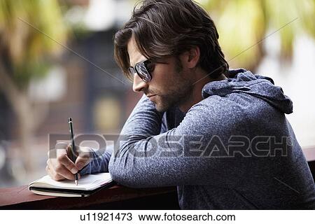 Man in sunglasses writing dirty View Large Photo Image Stock Image - Man in sunglasses writing dirty. Fotosearch