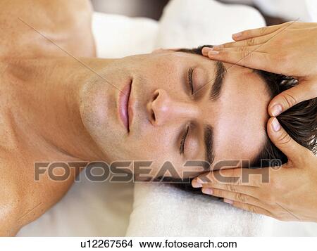 Man receiving massage in spa View Large Photo Image Picture - Man receiving massage in spa. Fotosearch