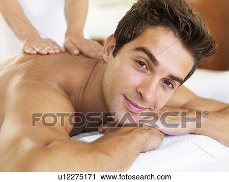 Man receiving massage in spa View Large Photo Image Stock Image - Man receiving massage in spa. Fotosearch