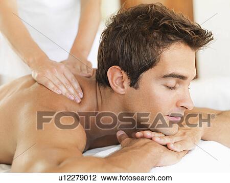 Man receiving massage in spa View Large Photo Image Stock Image - Man receiving massage in spa. Fotosearch