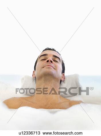 Man relaxing in bathtub View Large Photo Image Stock Image - Man relaxing in bathtub. Fotosearch