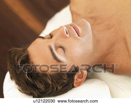 Stock Image - Man relaxing in spa. Fotosearch