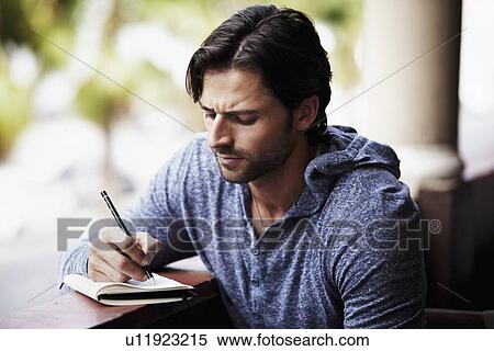 Stock Photography - Man writing diary. Fotosearch