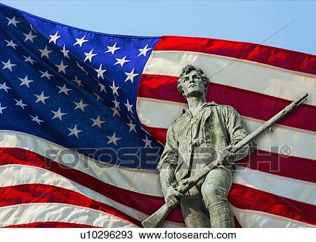 Stock Image - Minutemam statue with flag. Fotosearch