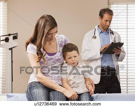 Mother with son (2-3) in doctor's office View Large Photo Image Stock Photo - Mother with son (2-3) in doctor's office. Fotosearch