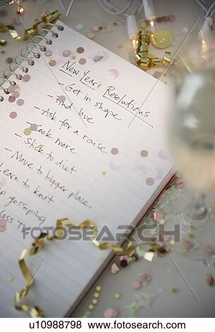 Stock Photo - Notepad with New Year's resolutions. Fotosearch