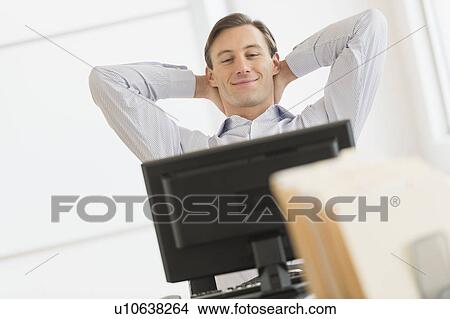 Picture - Office worker using computer. Fotosearch