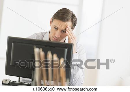 Office worker using computer View Large Photo Image Stock Image - Office worker using computer. Fotosearch
