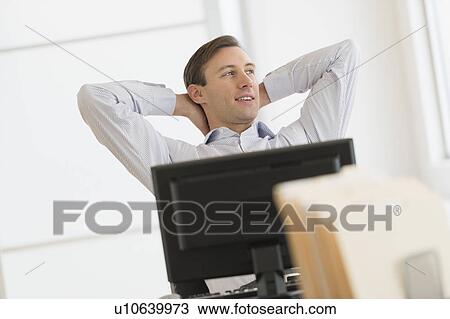 Office worker using computer View Large Photo Image Stock Image - Office worker using computer. Fotosearch