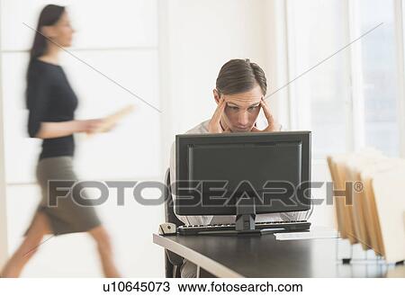 Office worker using computer View Large Photo Image Stock Image - Office worker using computer. Fotosearch