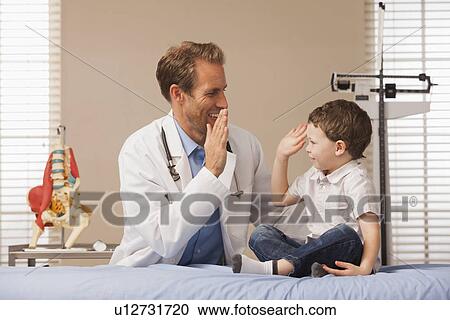 Pediatrician and boy (2-3) View Large Photo Image Stock Image - Pediatrician and boy (2-3). Fotosearch
