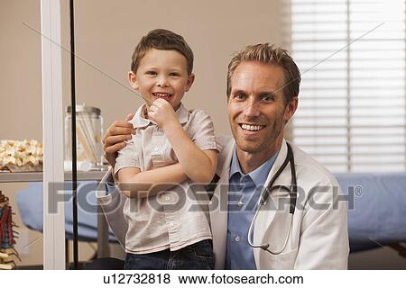 Stock Photo - Pediatrician and boy (2-3). Fotosearch
