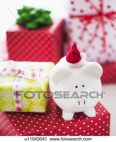 Piggy bank and christmas gifts View Large Photo Image Stock Image - Piggy bank and christmas gifts. Fotosearch