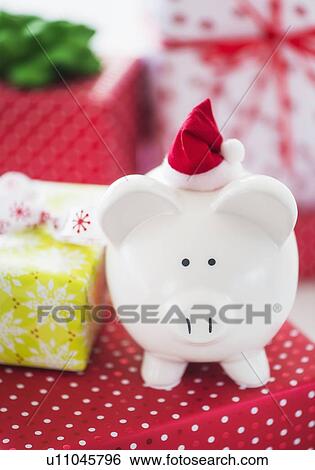 Piggy bank and christmas gifts View Large Photo Image Stock Photograph - Piggy bank and christmas gifts. Fotosearch