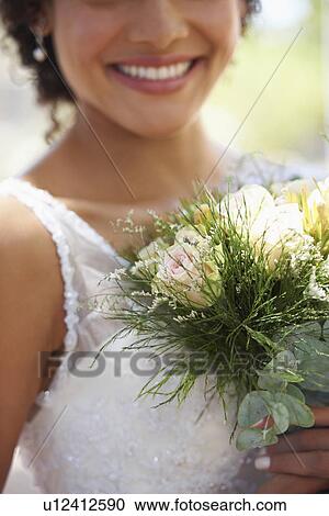 Stock Image - Portrait of bride with bouquet. Fotosearch