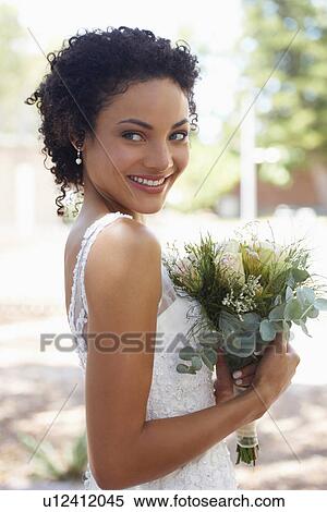 Portrait of bride with bouquet View Large Photo Image Stock Photography - Portrait of bride with bouquet. Fotosearch