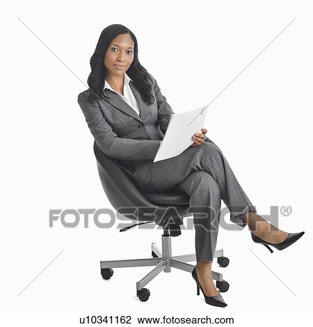 Portrait of businesswoman sitting in chair View Large Photo Image Stock Image - Portrait of businesswoman sitting in chair. Fotosearch