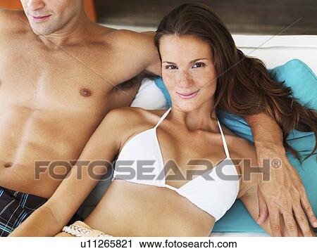 Stock Image - Portrait of couple relaxing. Fotosearch