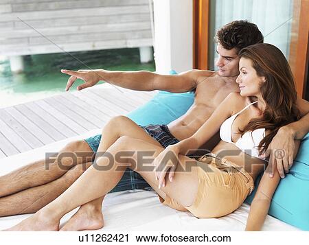 Stock Image -  Portrait of couple relaxing together. Fotosearch