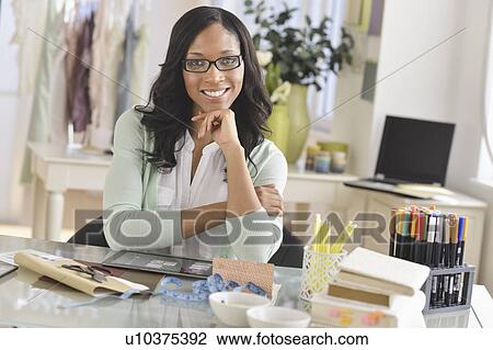 Portrait of female entrepreneur in workplace View Large Photo Image Stock Image - Portrait of female entrepreneur in workplace. Fotosearch