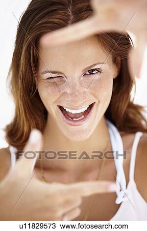 Stock Image - Portrait of gesturing woman . Fotosearch