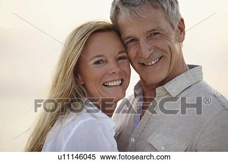 Stock Photography - Portrait of happy mature couple. Fotosearch