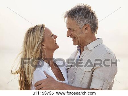 Stock Photography - Portrait of happy mature couple. Fotosearch