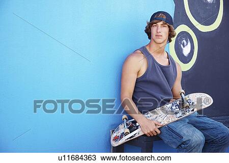 Portrait of male skateboarder View Large Photo Image Stock Image - Portrait of male skateboarder. Fotosearch