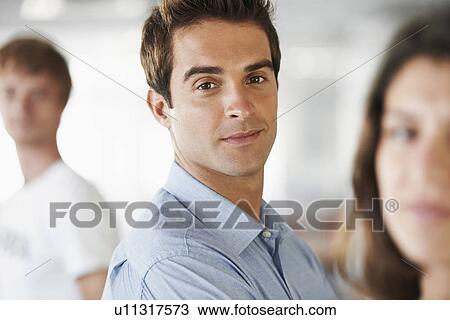 Stock Image - Portrait of man and two other people. Fotosearch